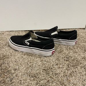 Women’s size 5. Five black slip on vans